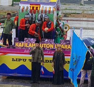 Wakil Bupati Buton Utara Ahali Pimpin Pawai Taaruf Ditengah Guyuran Hujan